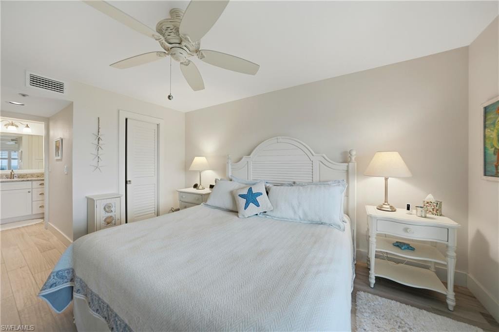 Primary Bedroom with Plantation Shutters, Tile Flooring and Ceiling Fan, Dual Closets