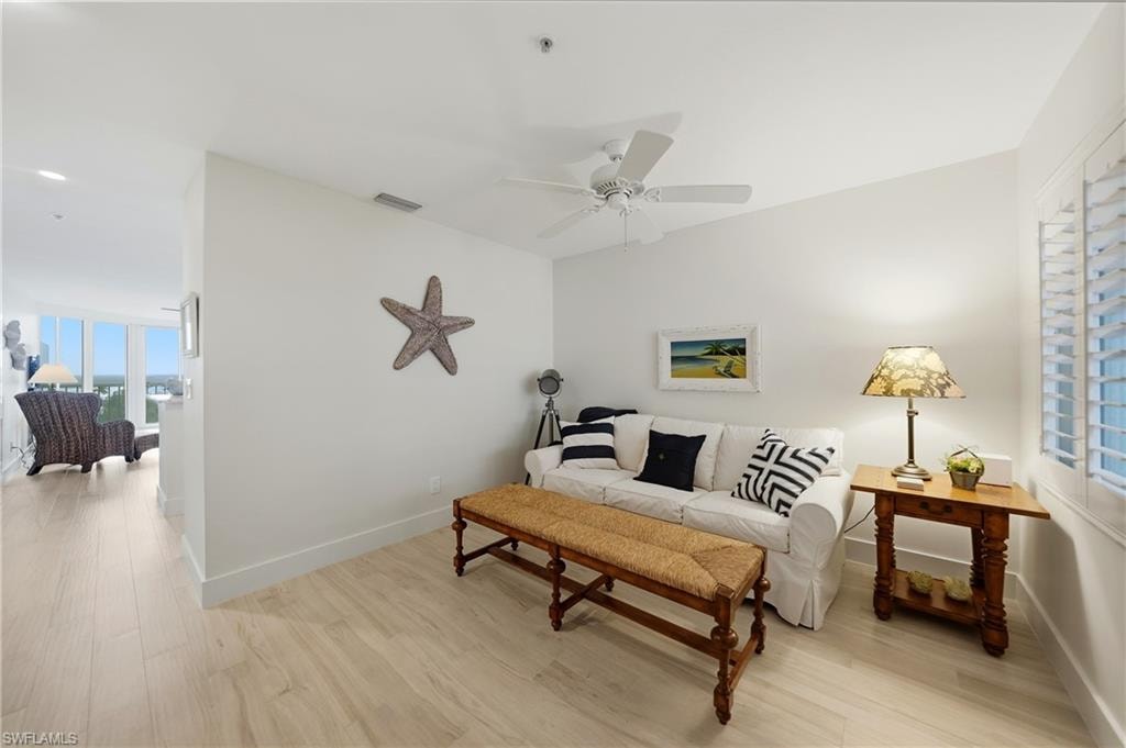 Den with Plantation Shutters, Tile Flooring, Ceiling Fan