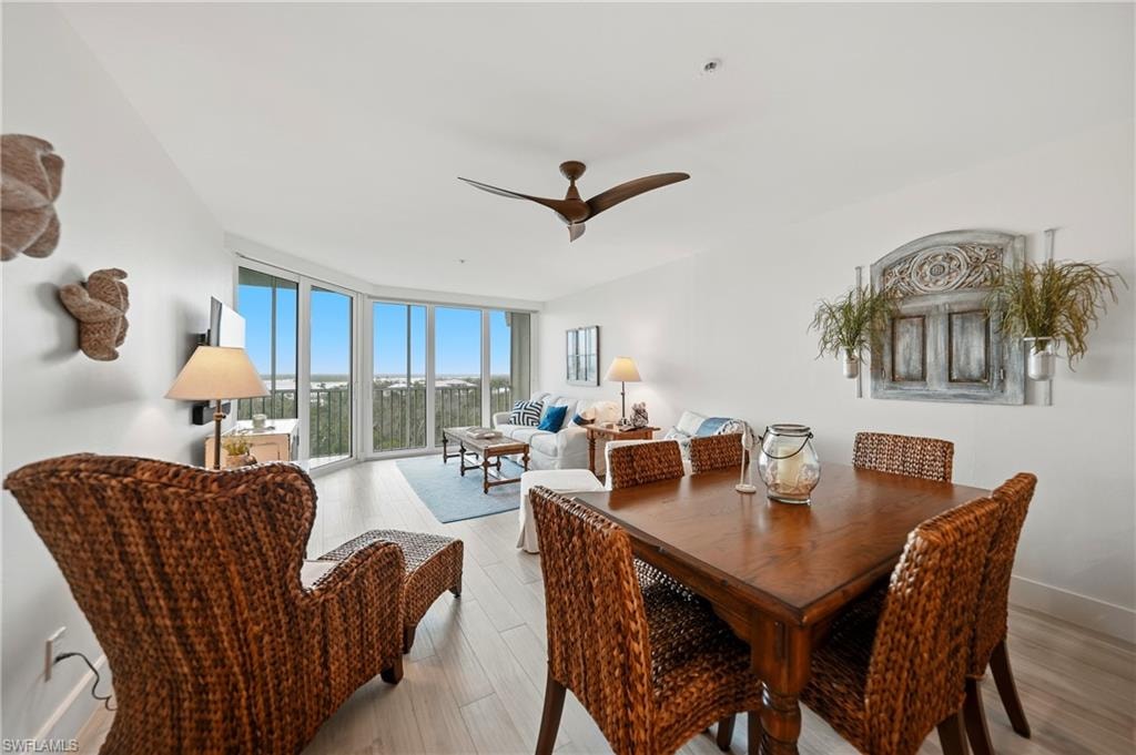 Dining/Living Room Open Concept - Bay Views, Tile Flooring, Ceiling Fan, Impact Doors