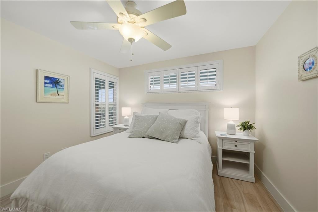 2nd Bed with Plantation Shutters, Tile Flooring, and Ceiling Fan