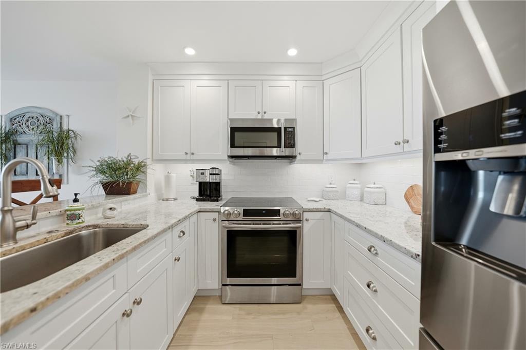 Open Kitchen with Wood Cabinets, Under Cabinet Lighting, Breakfast Bar and Stainless Appliances, Pantry, Tile Flooring