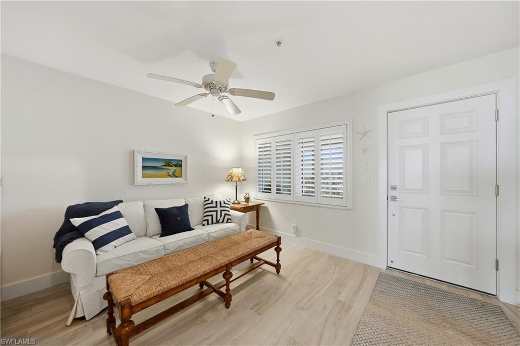Den with Plantation Shutters, Tile Flooring, Ceiling Fan