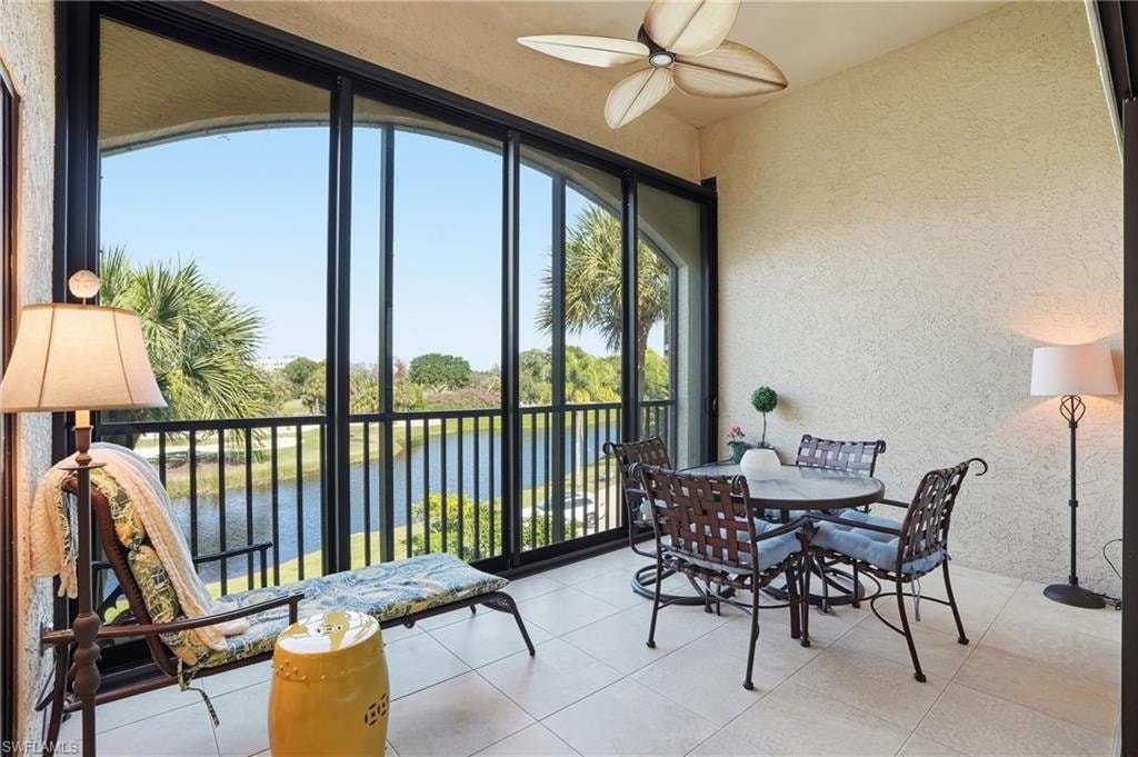 Sunroom with a water view