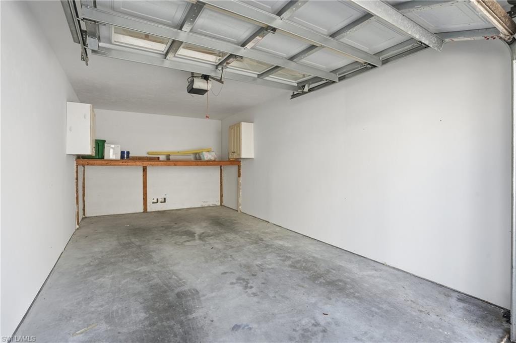 Garage featuring a garage door opener
