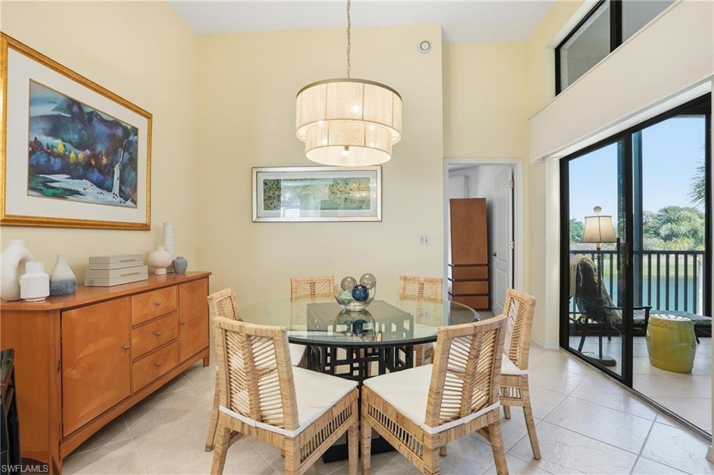 Dining space with a high ceiling