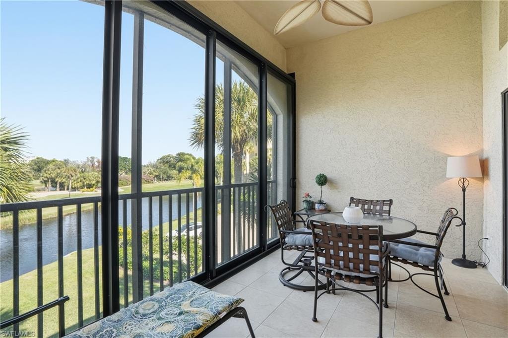 Sunroom with a water view