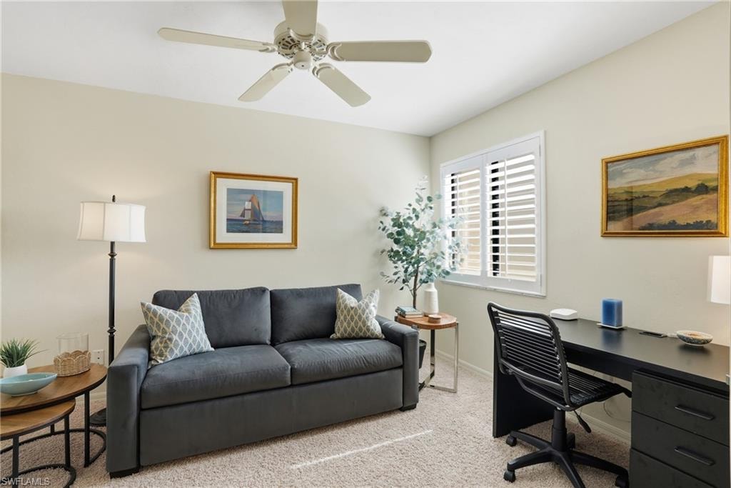 Office space with carpet flooring and ceiling fan