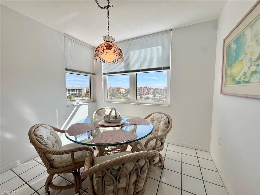 Dining room featuring light tile patterned floors with great natural light