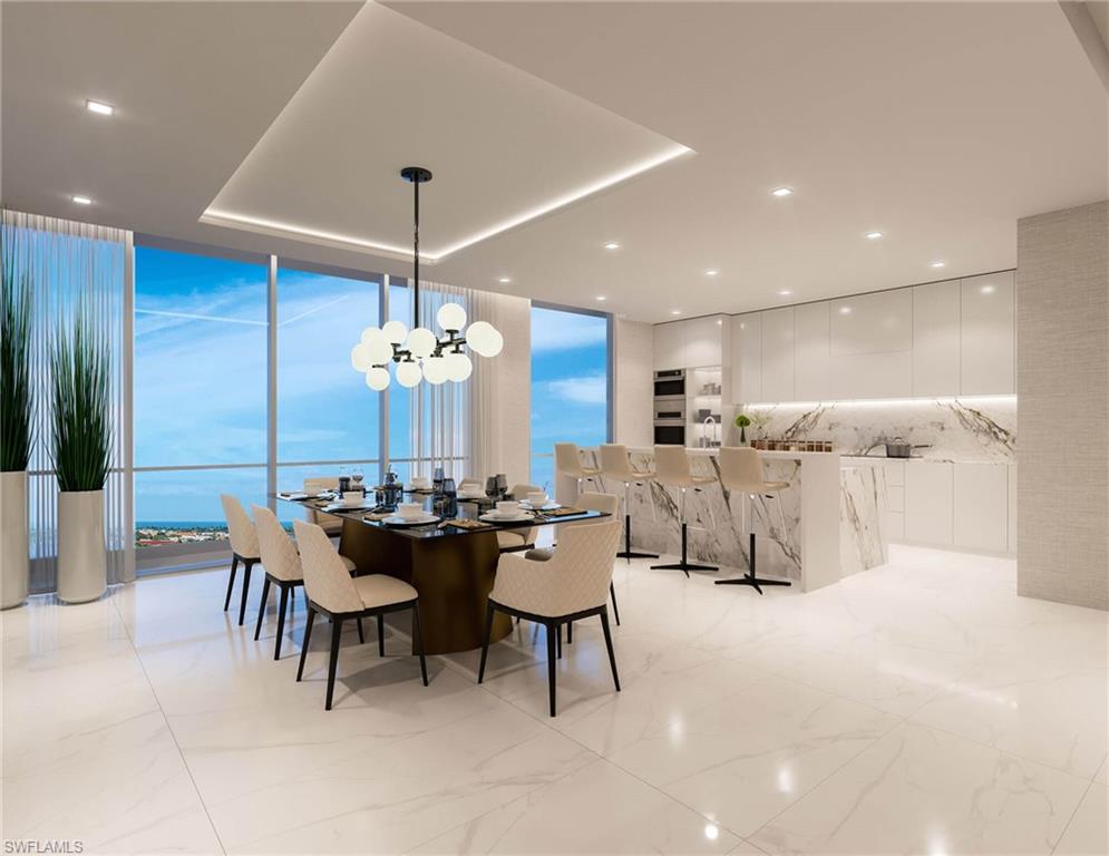 Dining space featuring a floor to ceiling windows, recessed lighting, and light marble finish flooring