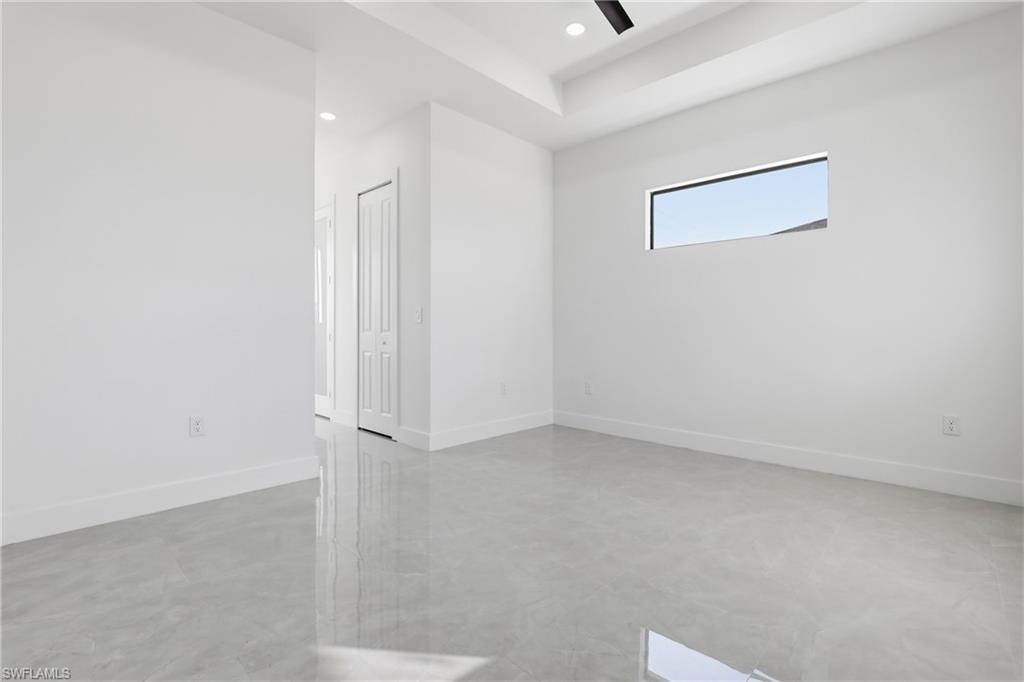 Unfurnished room featuring finished concrete floors, recessed lighting, and a ceiling fan