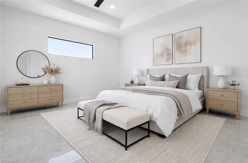 Bedroom with ceiling fan and recessed lighting. Digitally Staged.