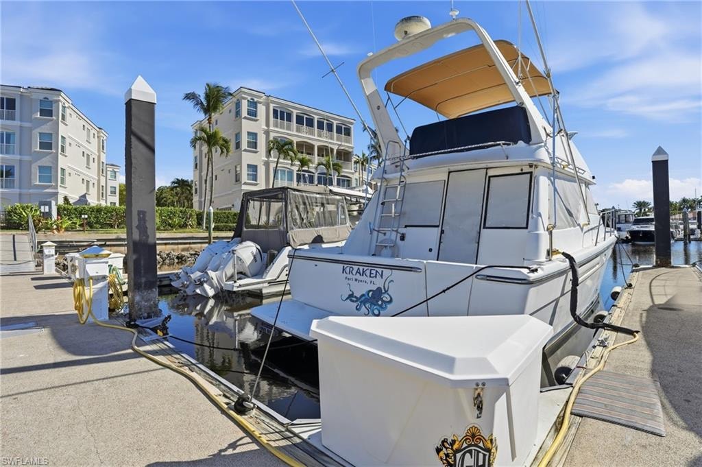 Dock area featuring a water view