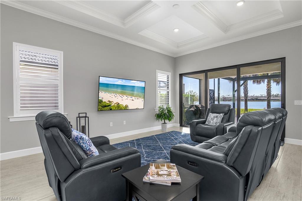 Great room with impact resistant sliders leading to covered lanai space.
