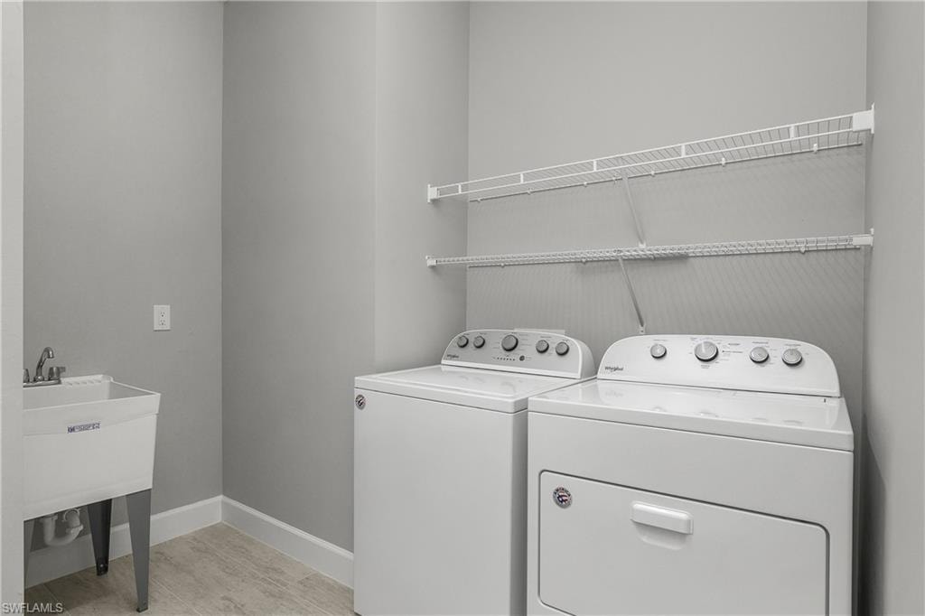 Oversized laundry room with utility sink.