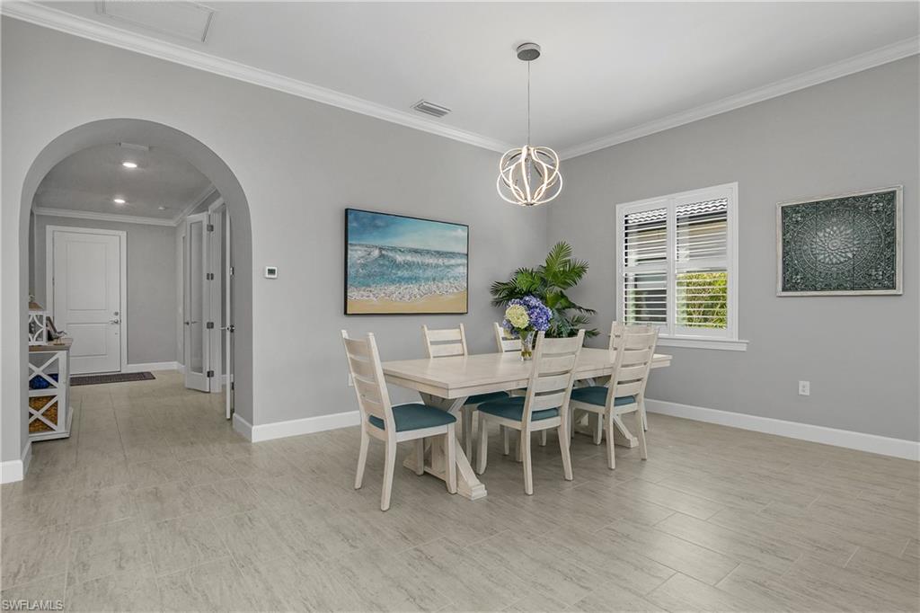 Family dining area accented by designer LED chandelier.
