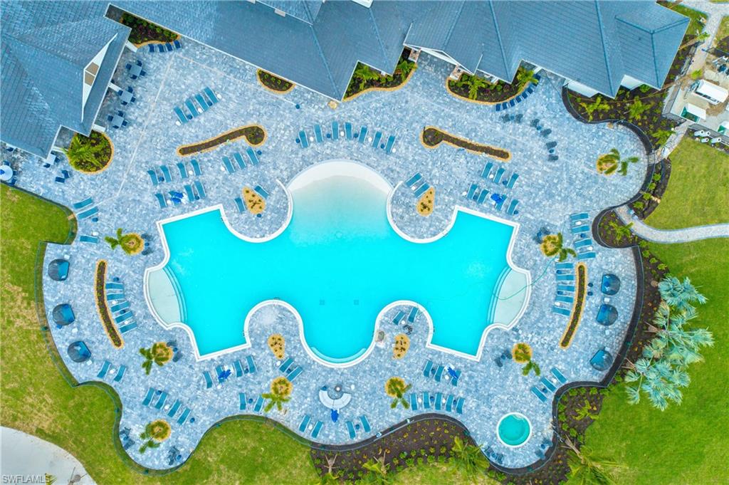 Resort style pool and spa with poolside service available at various times of the year and lake views.