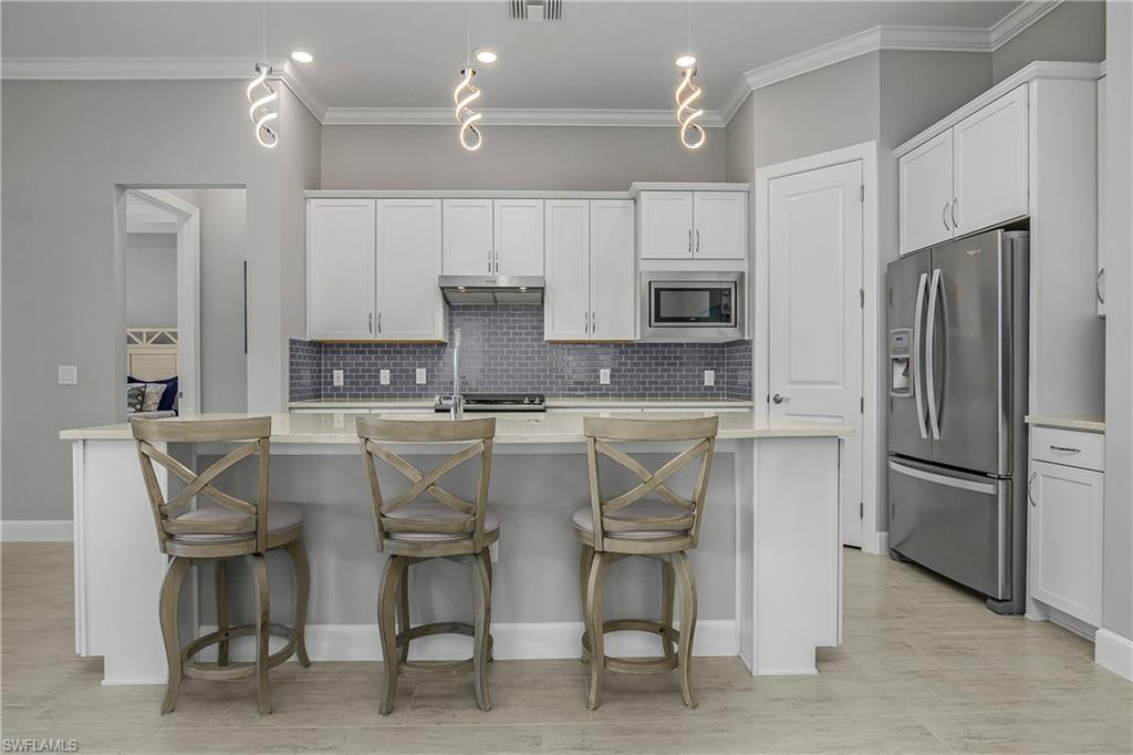 Enjoy custom designer LED lighting, a natural gas stove and an open kitchen, living, dining area--perfect for entertaining.