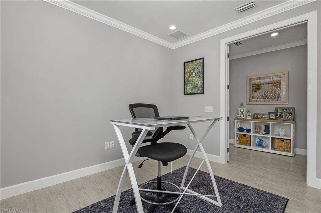 Den, featuring double french entry doors is the perfect home office.