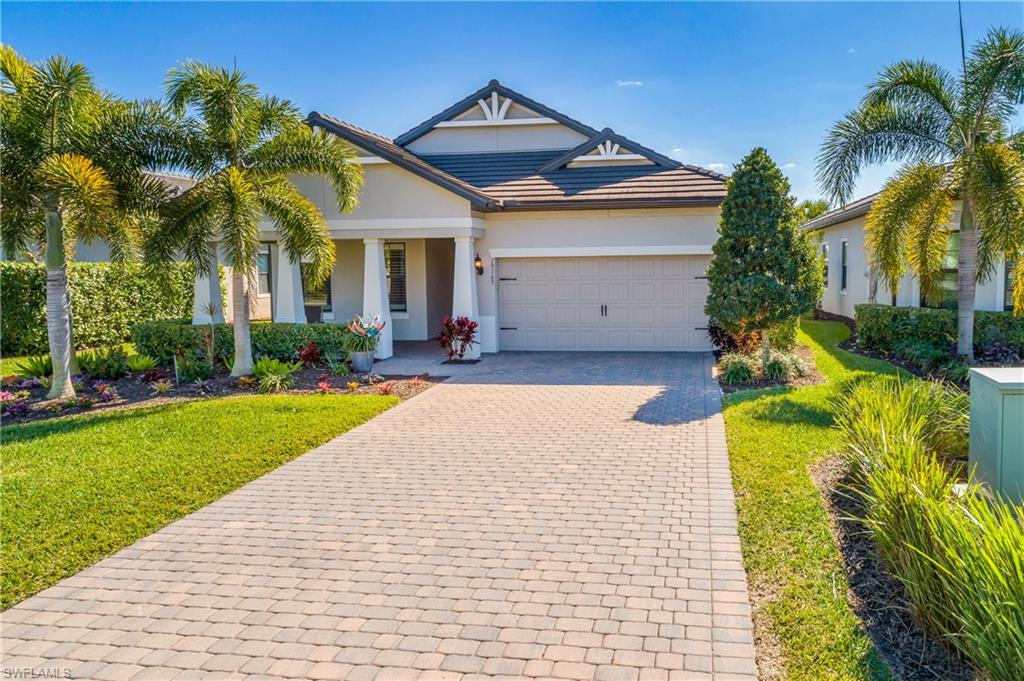 Larger lot with longer than typical driveway and professional landscaping.
