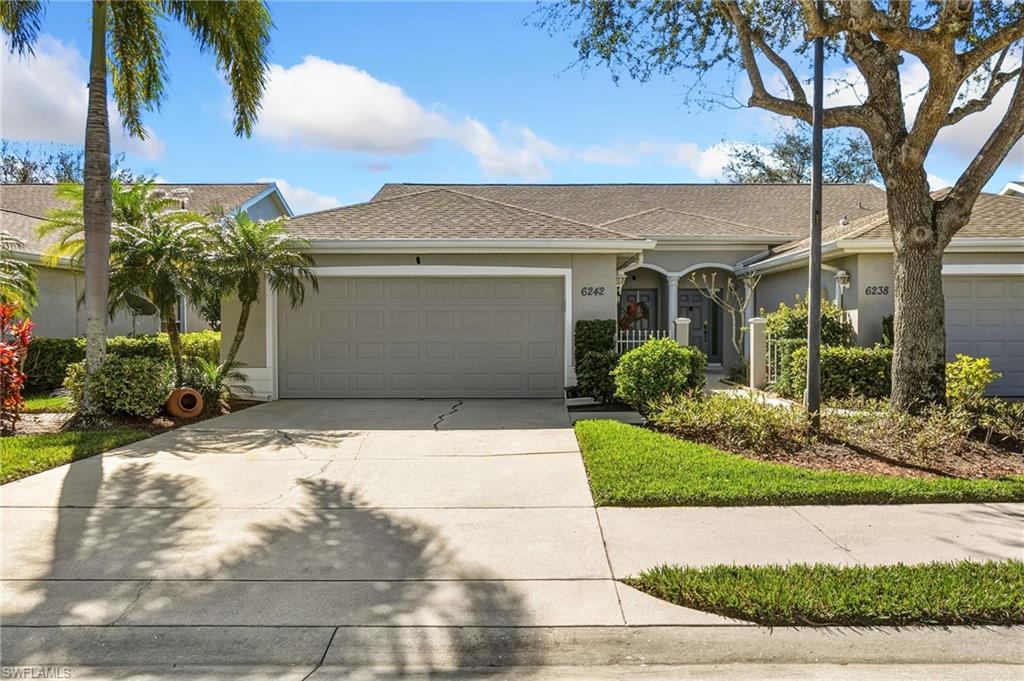 Ranch-style house with stucco siding, concrete driveway, an attached garage, and a shingled roof