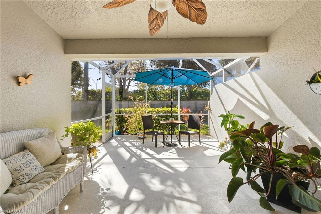 Sunroom / solarium featuring ceiling fan, a patio, and an outdoor hangout area