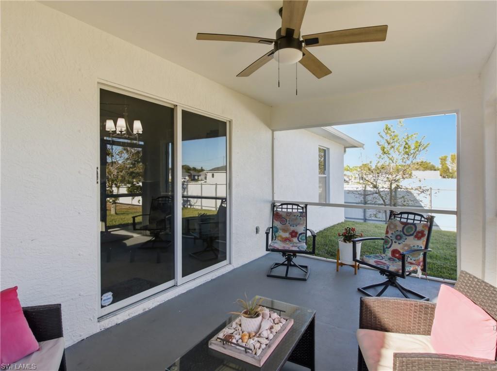 Balcony with an outdoor hangout area and ceiling fan
