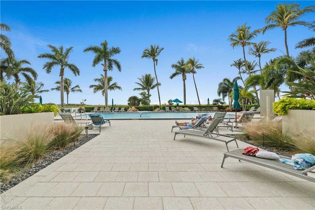 Community pool featuring a patio