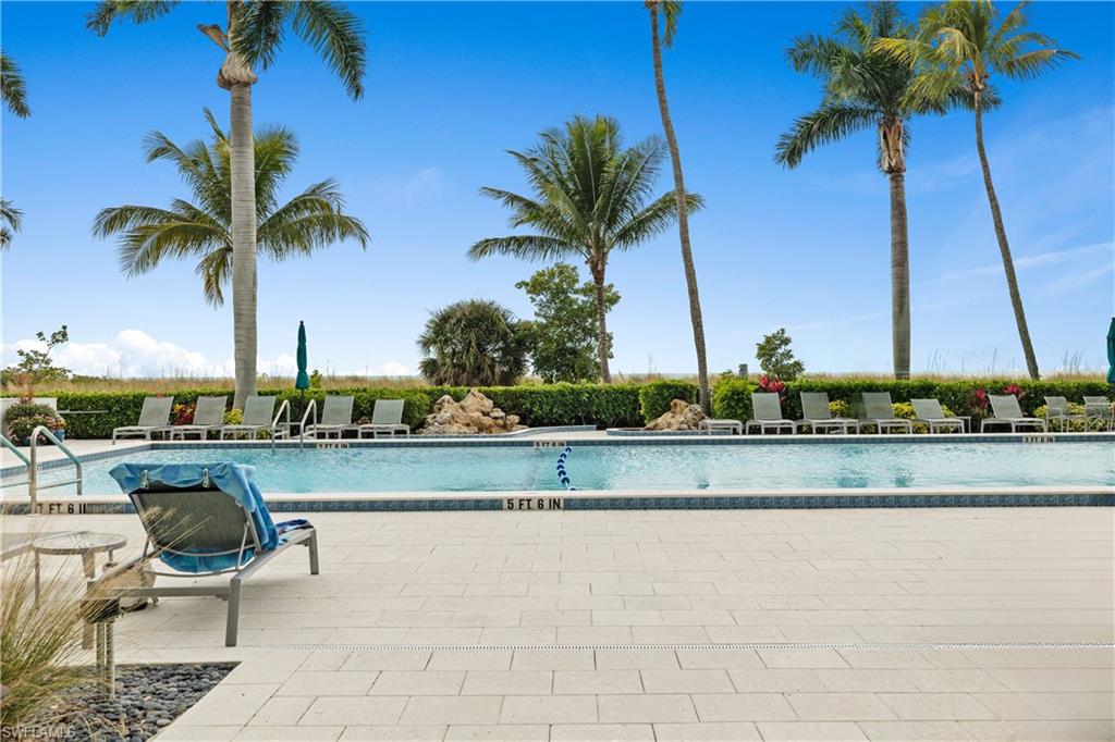 Community pool with a patio