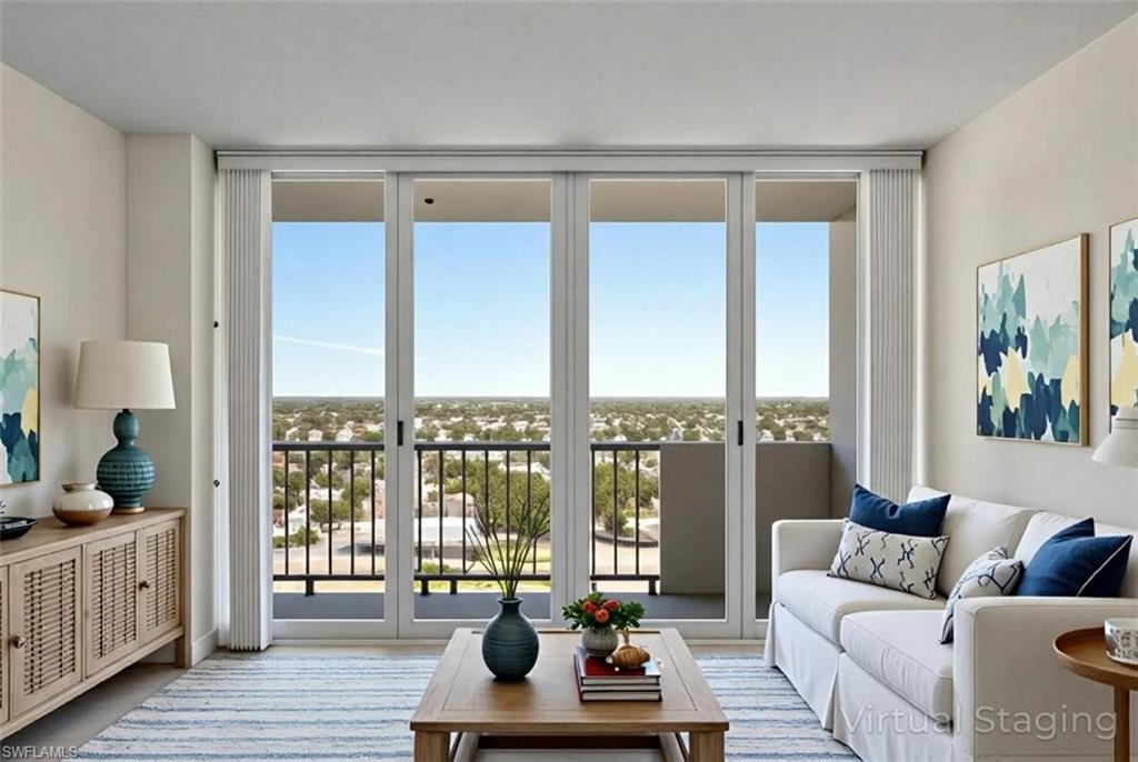 Living room featuring floor to ceiling windows
