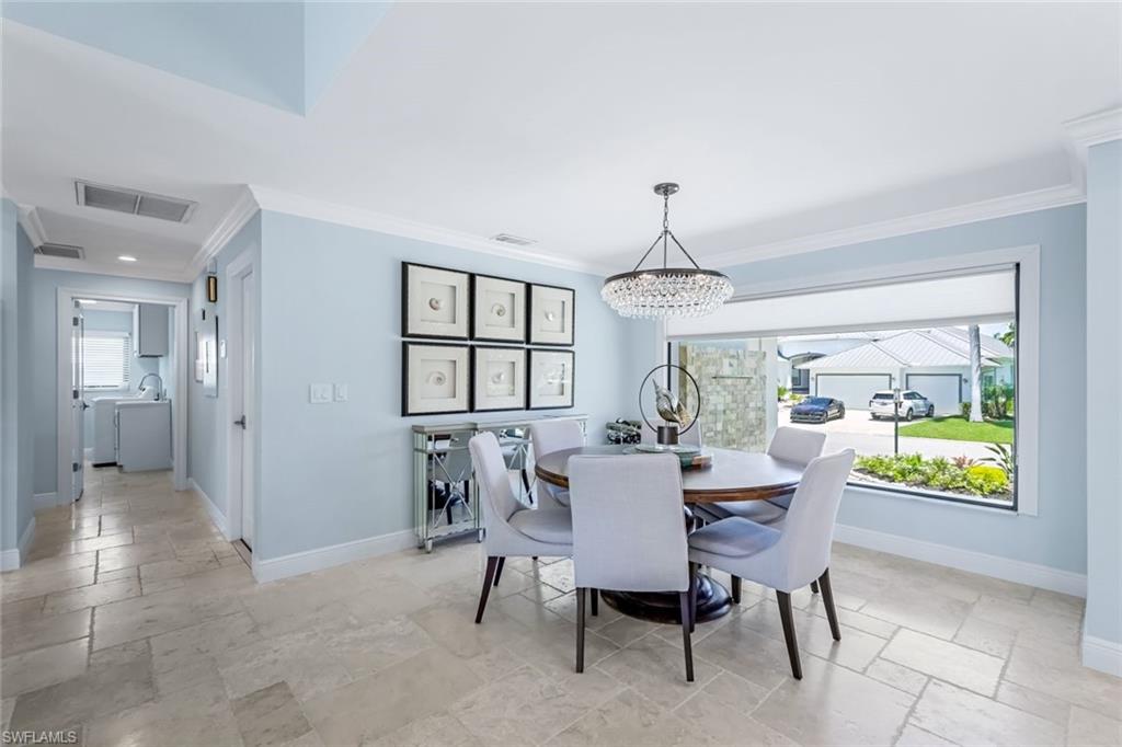 Formal dining room with large picture window.