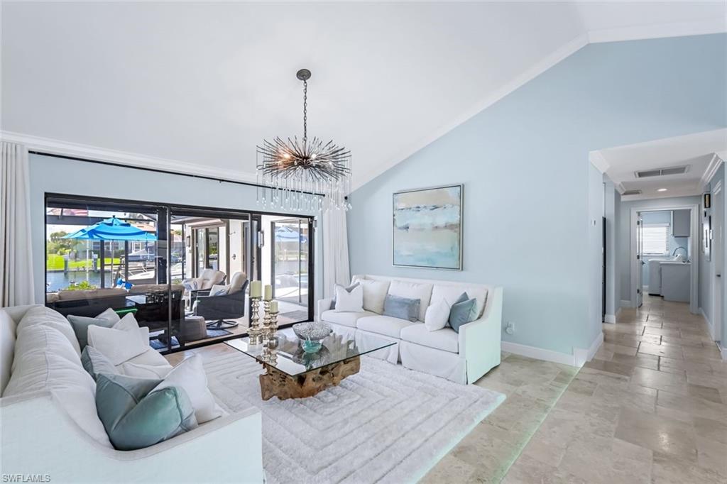 Formal living room overlooking pool and canal.