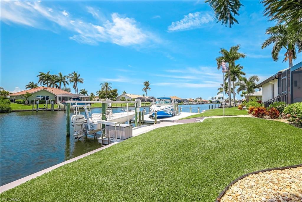 Canal, docks, and beautiful yard