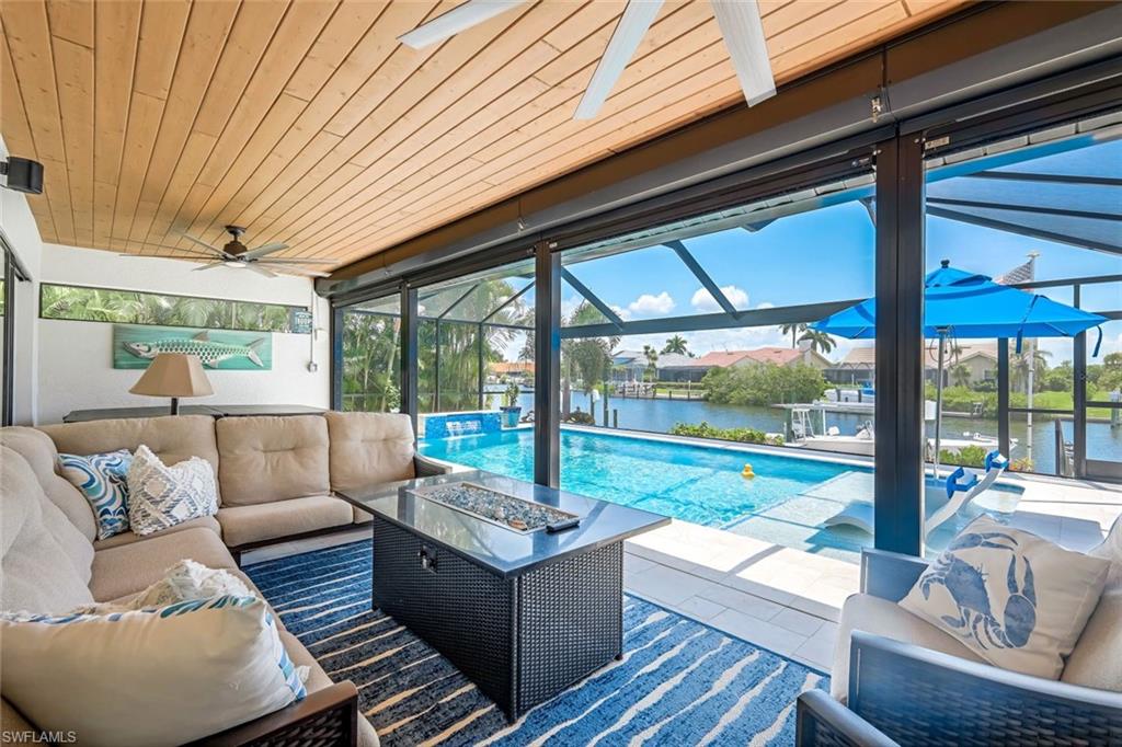 Spend your morning, afternoons, or evenings overlooking the pool and canal enjoying your favorite beverage! Tongue and grove ceiling.