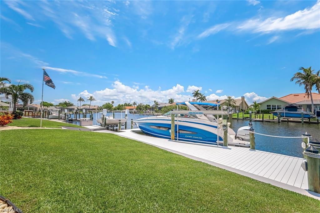Canal, docks, and beautiful yard