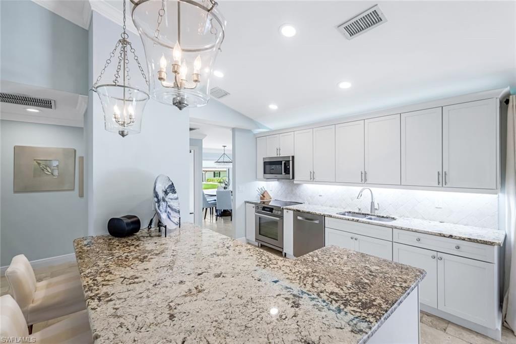 Bright & open kitchen with Bosch appliances and granite countertops