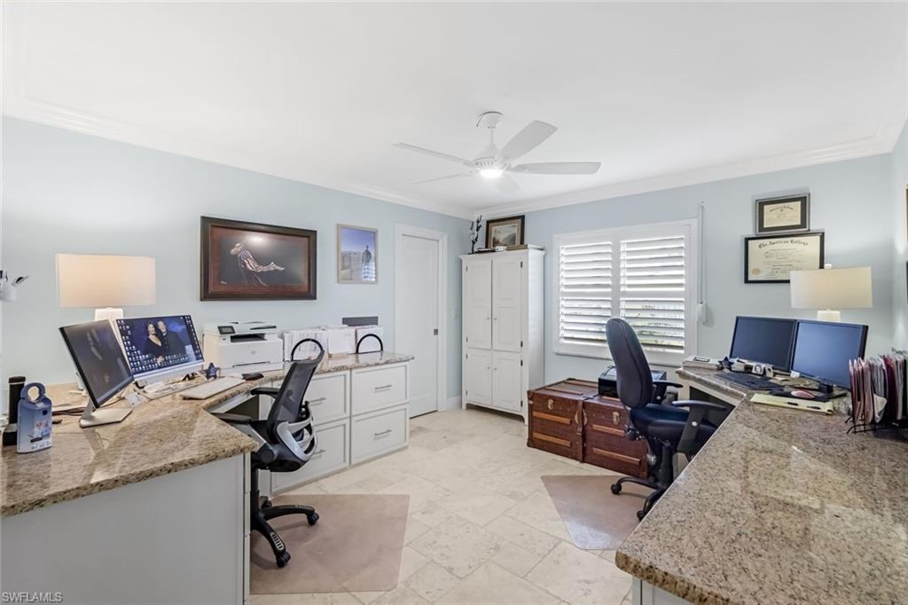 3rd bedroom currently utilized as a home office. Cabinetry is built on top of the stone floors to easily converty into a bedroom. Walk in closet.