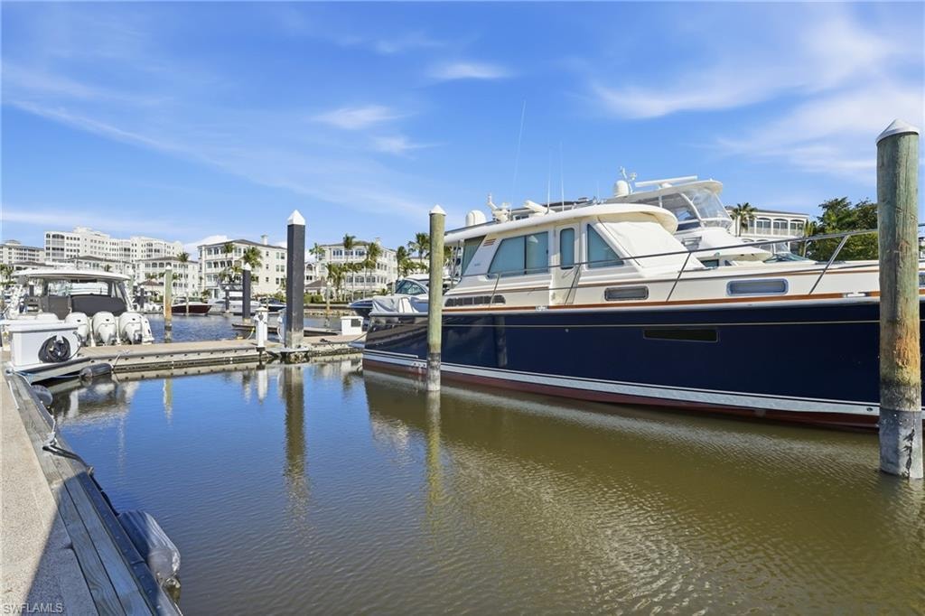 Dock area featuring a water view