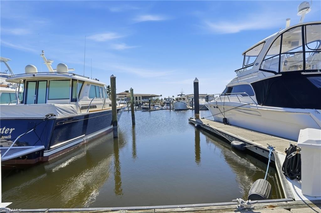 Dock area featuring a water view