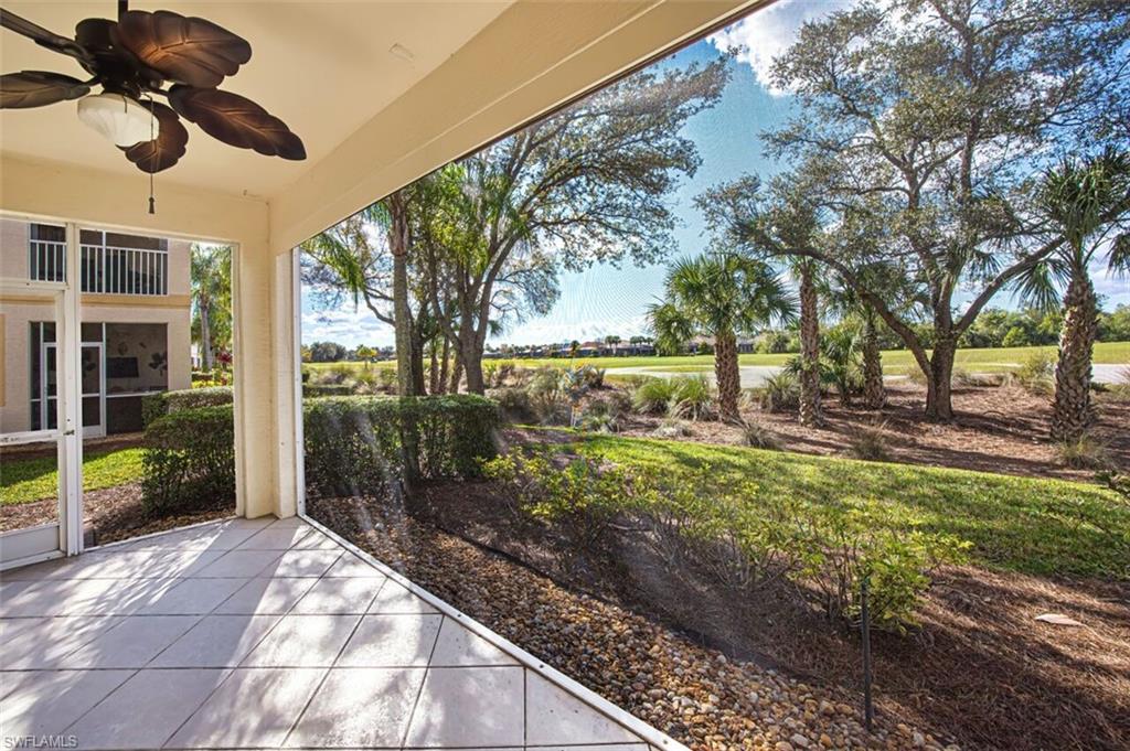 View of patio featuring a ceiling fan and a sunroom