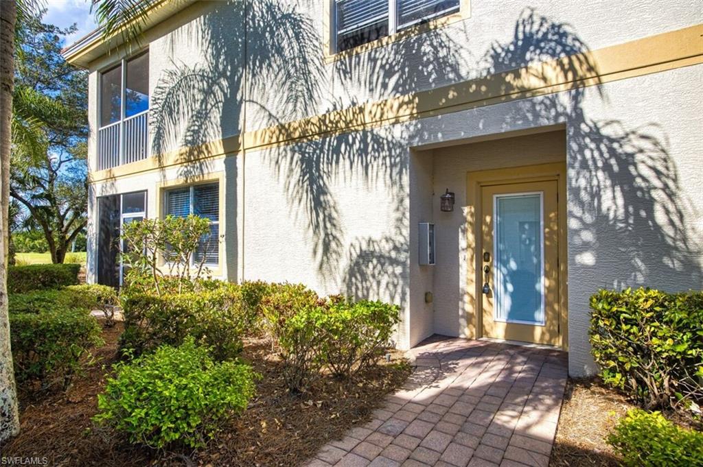 Property entrance with stucco siding