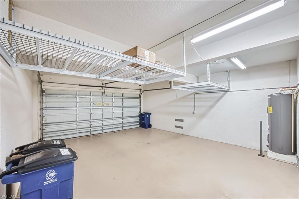 Garage featuring electric water heater