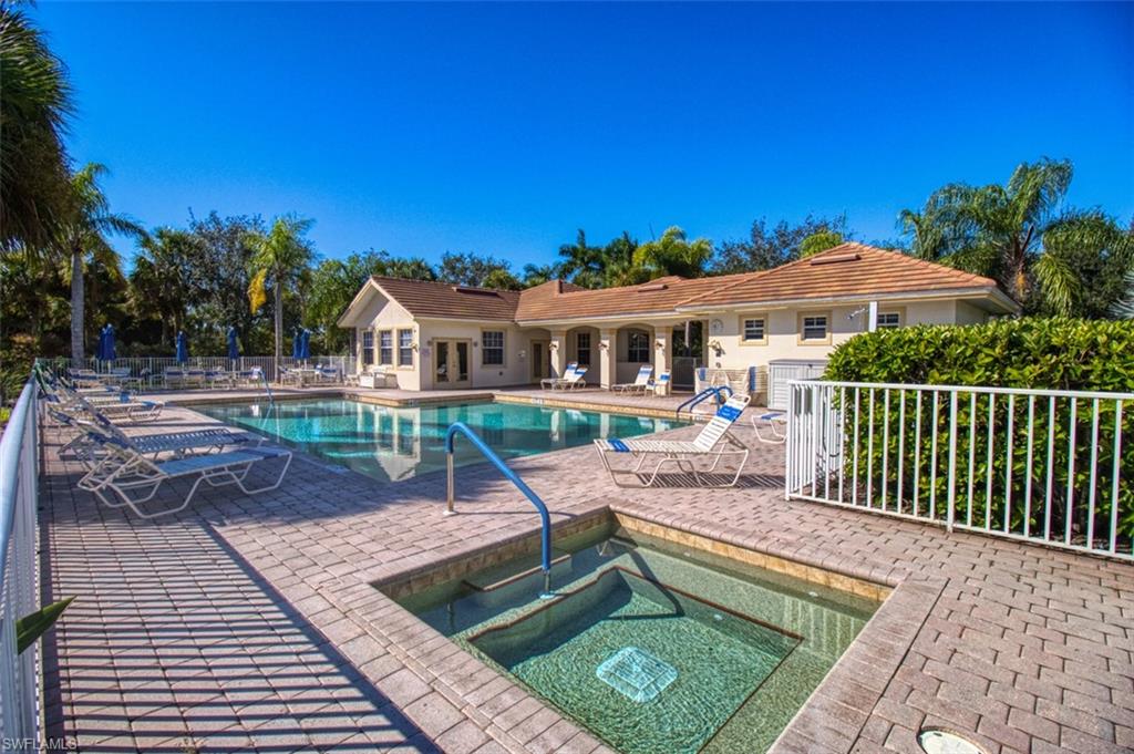 Community pool with a hot tub and a patio