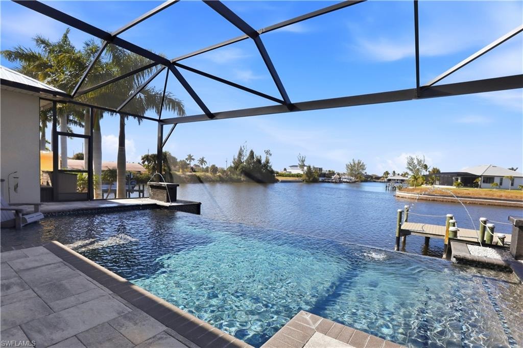 View of Infinity Edge swimming pool from the lanai and a deep water view with DIRECT ACCESS to the GULF with NO BRIDGES!