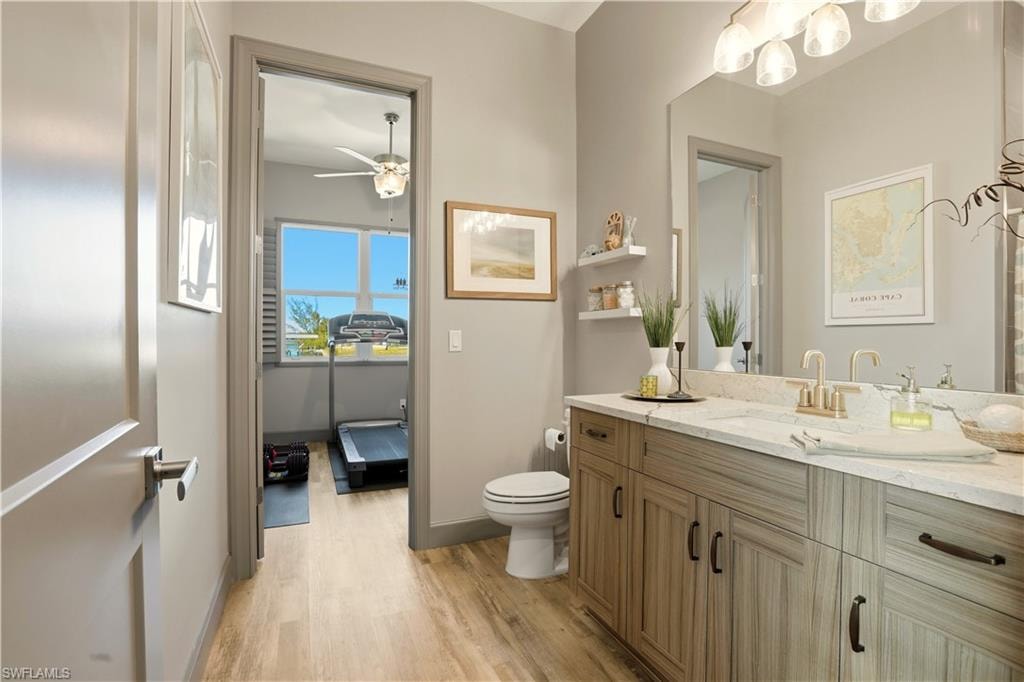 3rd Bathroom with vanity, light wood finished floors, and ceiling fan