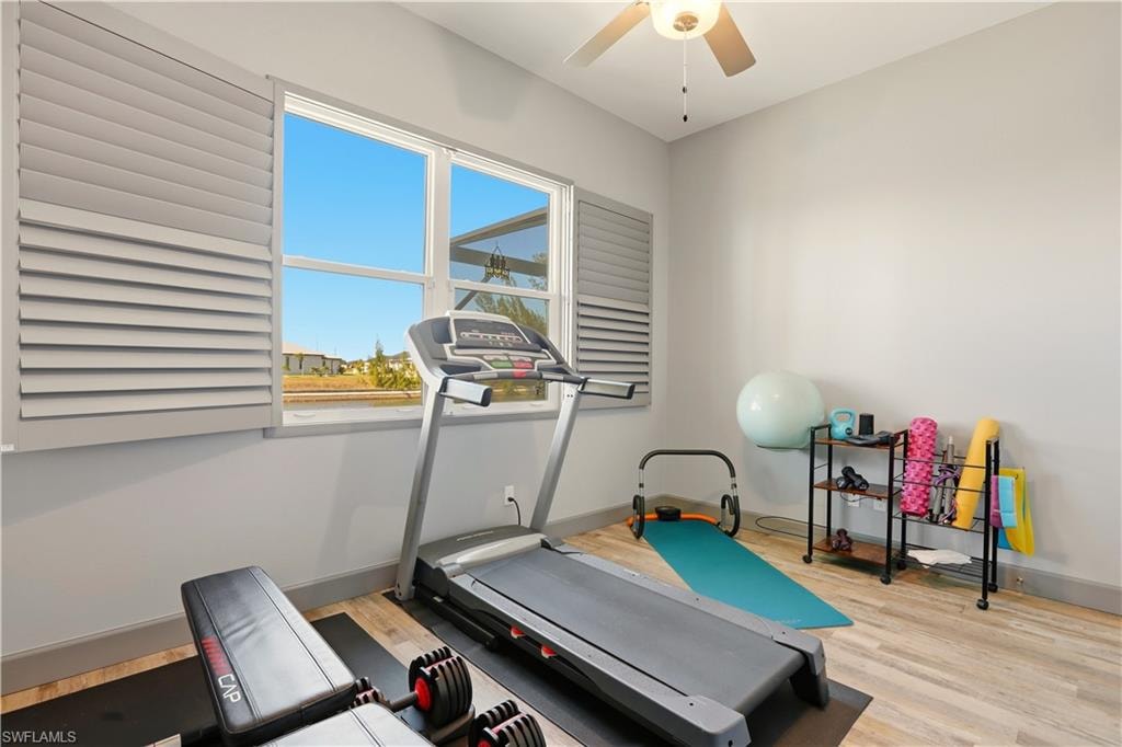 5th Bedroom or Workout area with light wood finished floors and ceiling fan