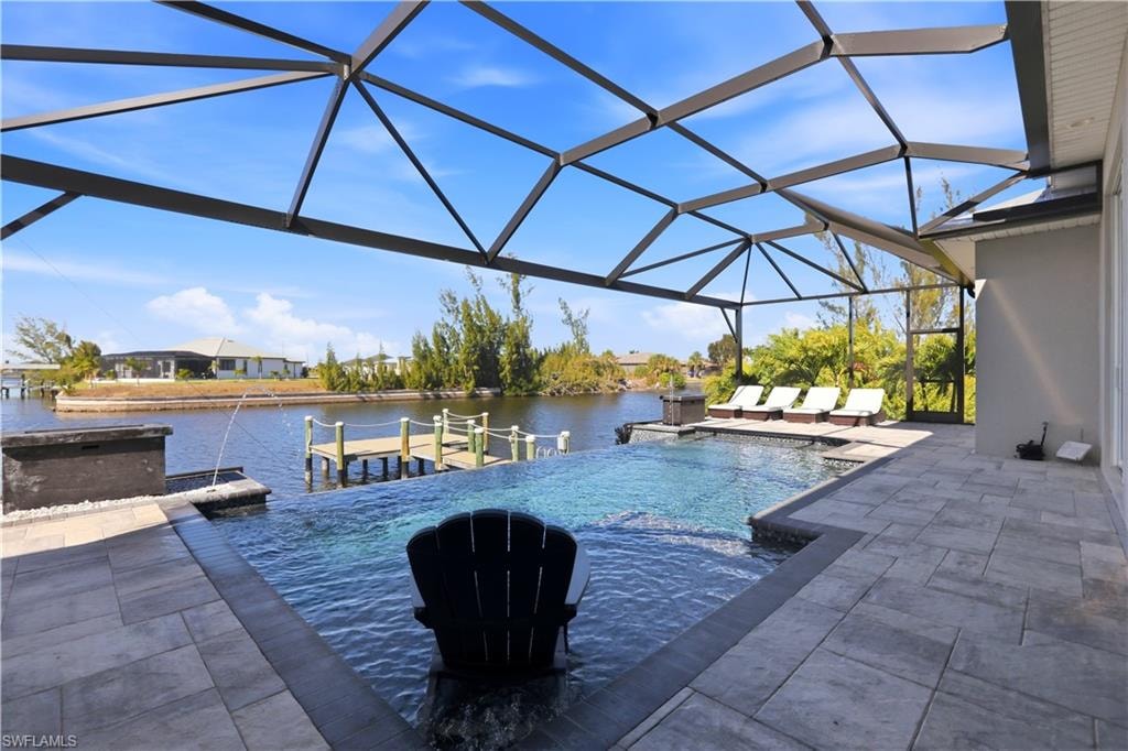 Swimming pool with a large lanai and views to the custom dock.