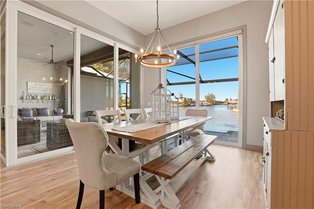 Dining space featuring light wood-style flooring and a chandelier