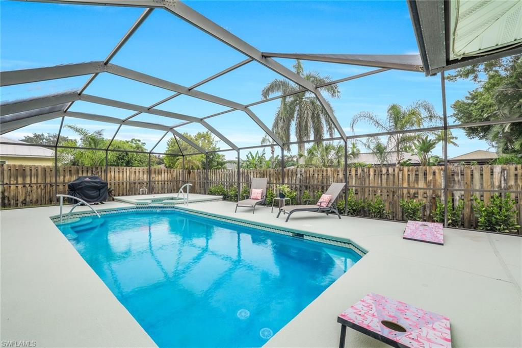 Screened in saltwater pool with whirpool spa.
