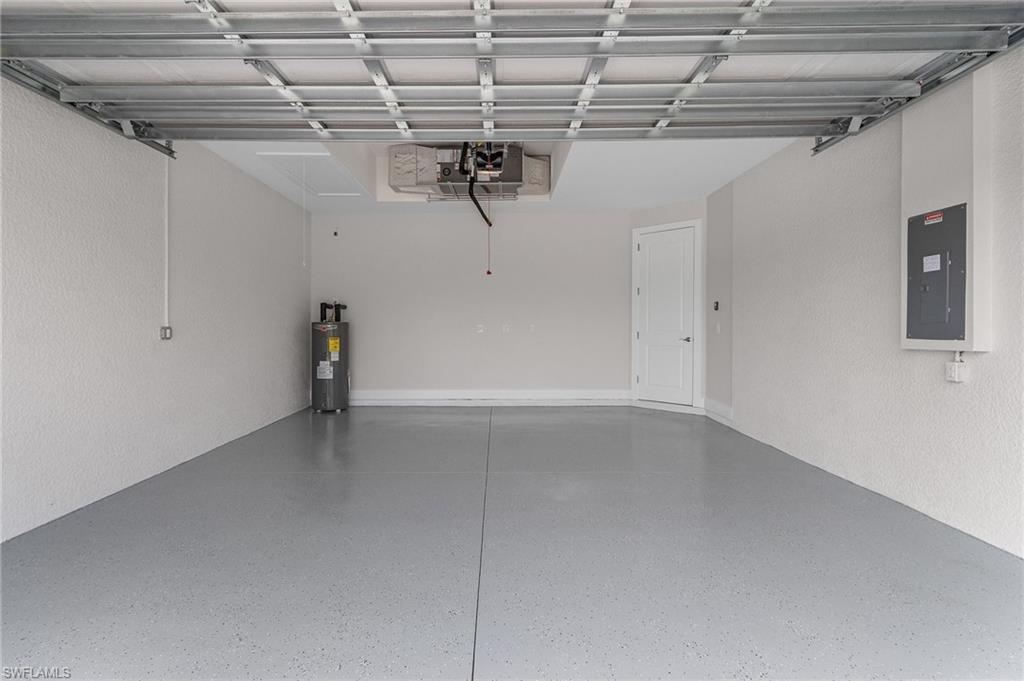 Garage with electric panel and water heater