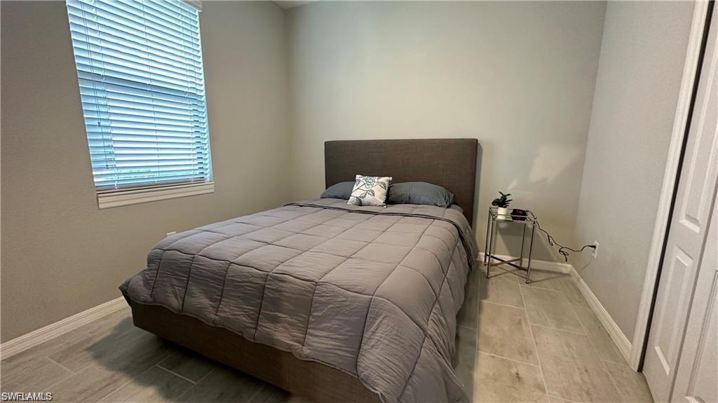 Bedroom with baseboards